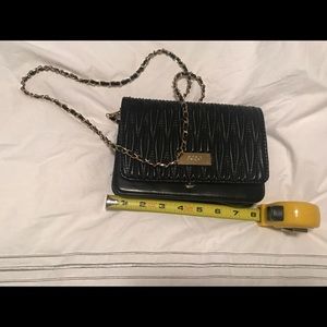 BCBG Black clutch purse option to carry.